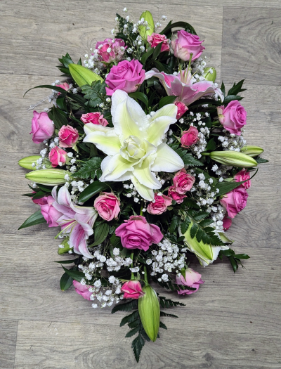 Pink single ended spray - Single ended spray in oasis made in pink shades to include lillies and roses. At The Flower Box we are delighted to present this product available for flower delivery in Knighton and surrounding areas and surrounding areas.