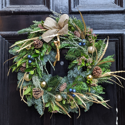 Blue and Gold Christmas Door Wreath - Blue and Gold Christmas Door Wreath,
Christmas spruce and carefully selected long-lasting foliage with accents of gold and Blue decorations. Perfect decoration for any Door this holiday season.
Each and every door wreath is handmade in our store using classic techniques on a moss base (no nasty floral foam), To get the most out of your Christmas wreath we recommend you place it moss side down on your lawn overnight or in a shallow bowl of water once a week or so to freshen up the moss and keep your wreath looking its best. 
Other colour options are available see our Christmas flowers section of the web shop.