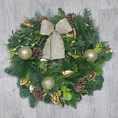 Golden Christmas Door wreath - Golden Christmas Door Wreath, Christmas spruce and carefully selected long-lasting foliage with accents of gold and natural decorations. Perfect decoration for any Door this holiday season. Each and every door wreath is handmade in our store using classic techniques on a moss base (no nasty floral foam), To get the most out of your Christmas wreath we recommend you place it moss side down on your lawn overnight or in a shallow bowl of water once a week or so to freshen up the moss and keep your wreath looking its best. Other colour options are available see our Christmas flowers section of the web shop.