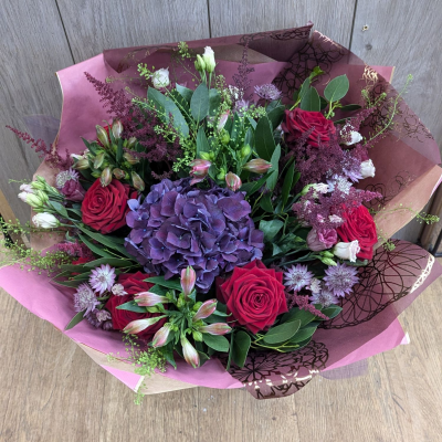 Mixed Valentines Handtie including luxury red roses - Scented Red Naomi roses with luxurious hydrangea, alstroemeria, astilbe, lisianthus and Astrantia, with glorious British eucalyptus foliage.